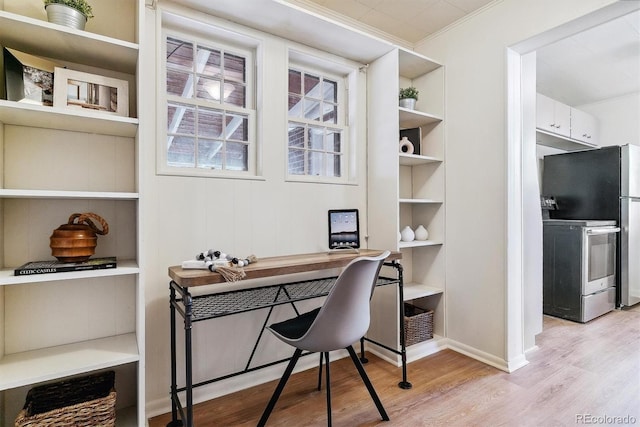 office featuring light hardwood / wood-style floors and ornamental molding