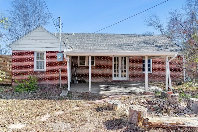 back of property featuring french doors and a patio