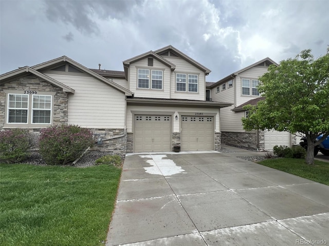 view of front of house with a garage and a front yard