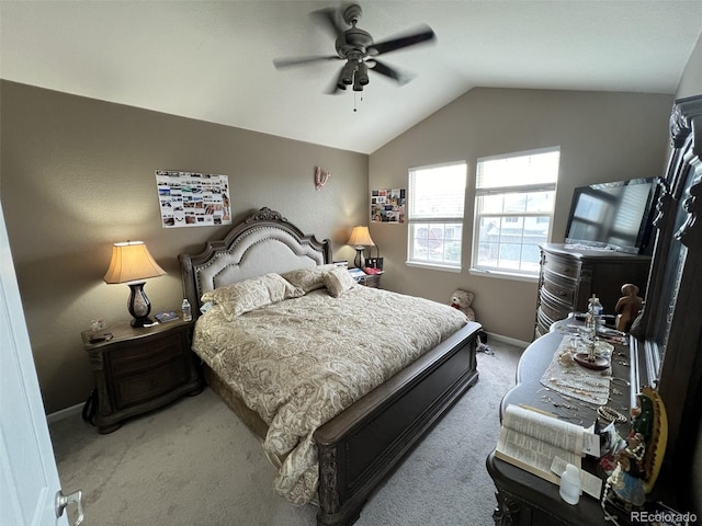 bedroom with vaulted ceiling, carpet flooring, and ceiling fan