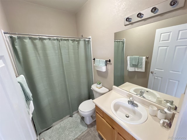 bathroom with vanity, tile patterned flooring, curtained shower, and toilet