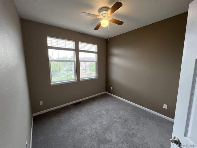 carpeted empty room featuring ceiling fan