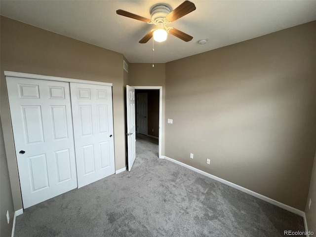 unfurnished bedroom featuring carpet floors, ceiling fan, and a closet