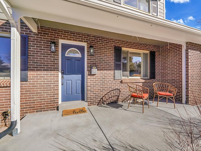 doorway to property with a porch