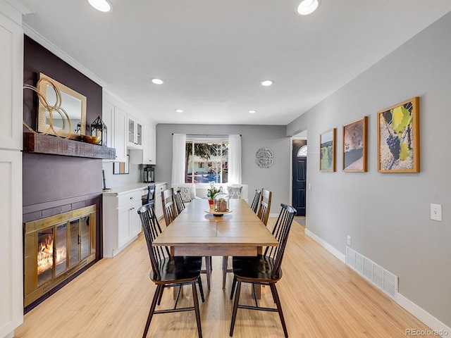 dining area with light hardwood / wood-style floors