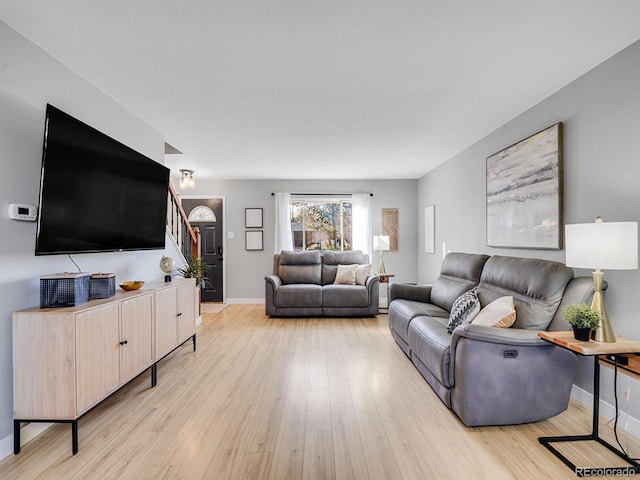 living room with light hardwood / wood-style floors