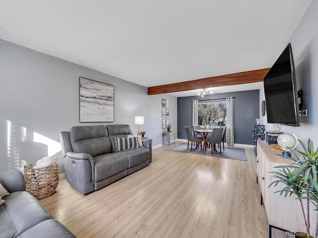 living room with beam ceiling and light hardwood / wood-style flooring