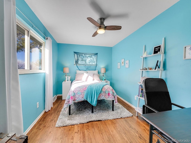 bedroom with ceiling fan and wood-type flooring