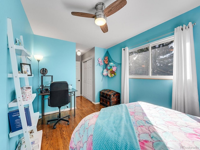 bedroom with wood-type flooring, ceiling fan, and a closet