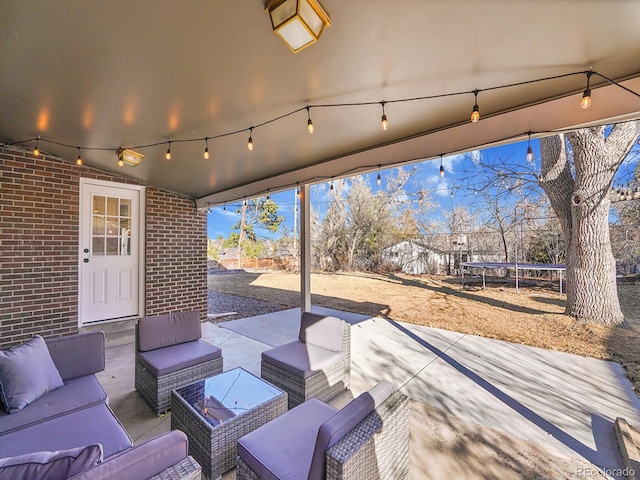 view of patio with an outdoor hangout area and a trampoline