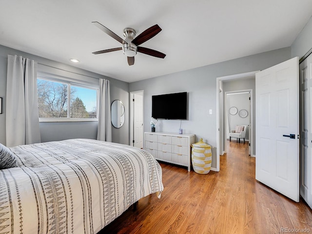 bedroom featuring light hardwood / wood-style flooring and ceiling fan