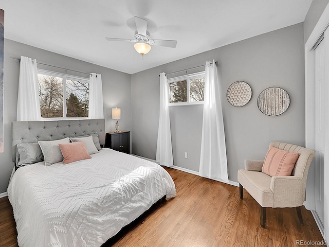 bedroom with hardwood / wood-style flooring and ceiling fan