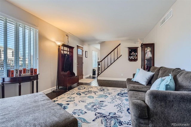 living room featuring dark hardwood / wood-style floors