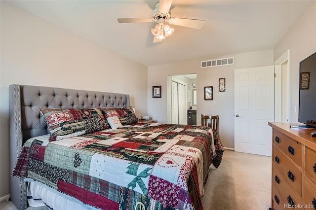 bedroom with ceiling fan and light colored carpet