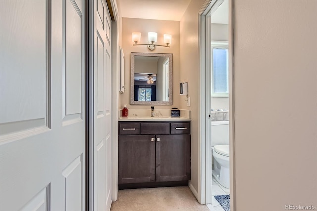 bathroom featuring toilet and vanity