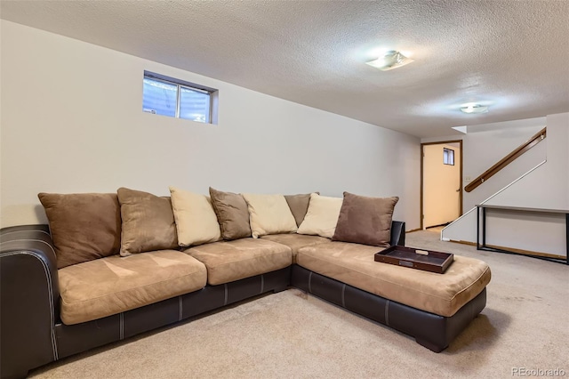 living room featuring a textured ceiling and light colored carpet