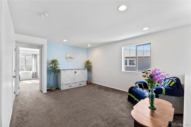 living area with recessed lighting, baseboards, and carpet floors