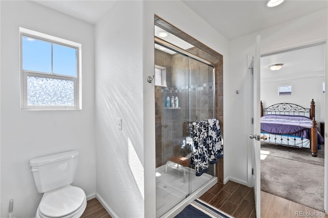 ensuite bathroom with ensuite bath, a shower stall, and wood tiled floor