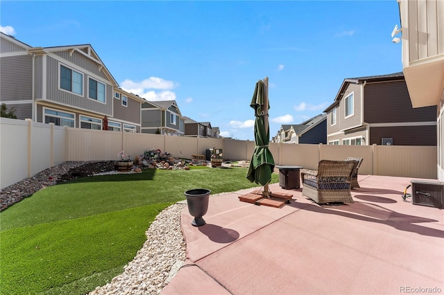 view of patio / terrace featuring a residential view and a fenced backyard