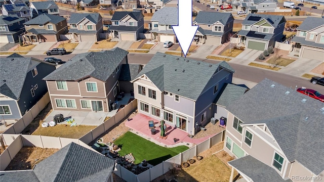 birds eye view of property with a residential view