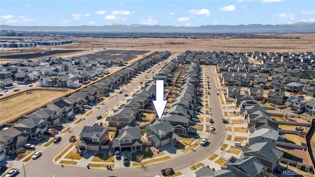 birds eye view of property with a residential view and a mountain view