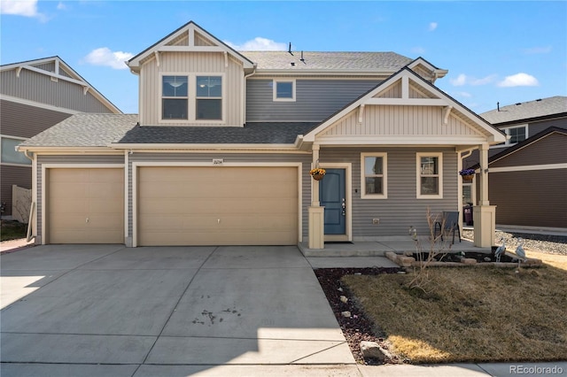 craftsman inspired home with covered porch, board and batten siding, a shingled roof, and concrete driveway