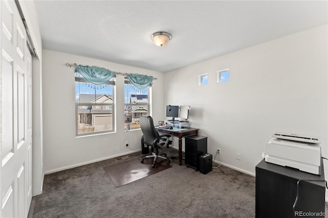 office area featuring carpet, visible vents, and baseboards
