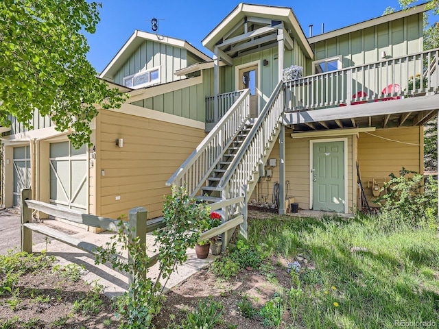 40 Cove Blvd Unit G40, Dillon, CO 80435 - view of front of house featuring board and batten siding, a deck, and stairs