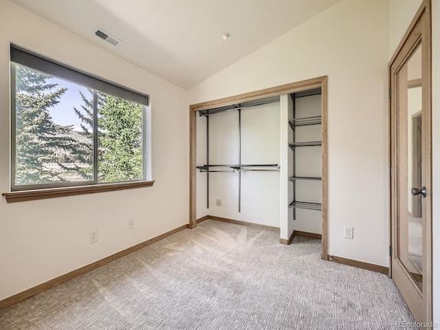 40 Cove Blvd Unit G40, Dillon, CO 80435 - unfurnished bedroom with light carpet, vaulted ceiling, baseboards, and a closet