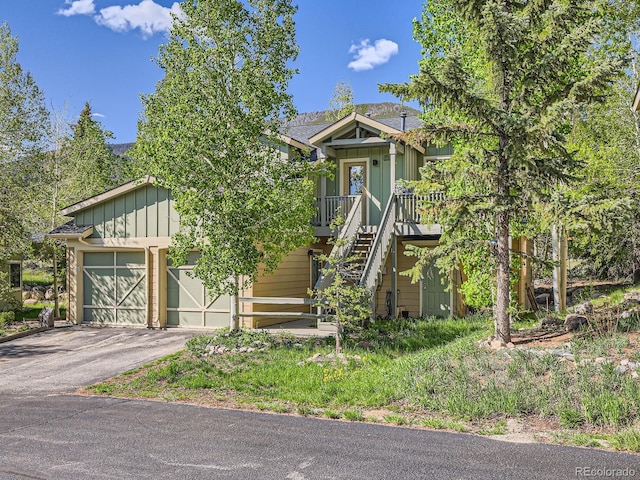 40 Cove Blvd Unit G40, Dillon, CO 80435 - view of front of house featuring board and batten siding, a garage, and driveway