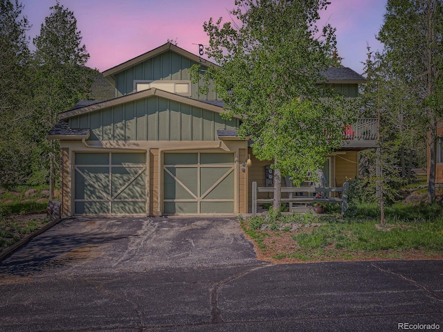 40 Cove Blvd Unit G40, Dillon, CO 80435 - view of front of house with driveway, board and batten siding, and a garage