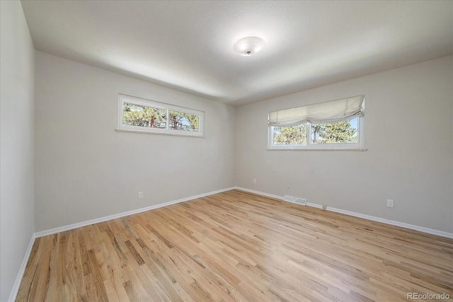 29827 Gigi Rd, Evergreen, CO 80439 - empty room featuring light wood-type flooring and baseboards