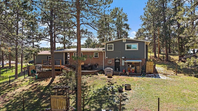 29827 Gigi Rd, Evergreen, CO 80439 - rear view of house with a deck, brick siding, and stairway
