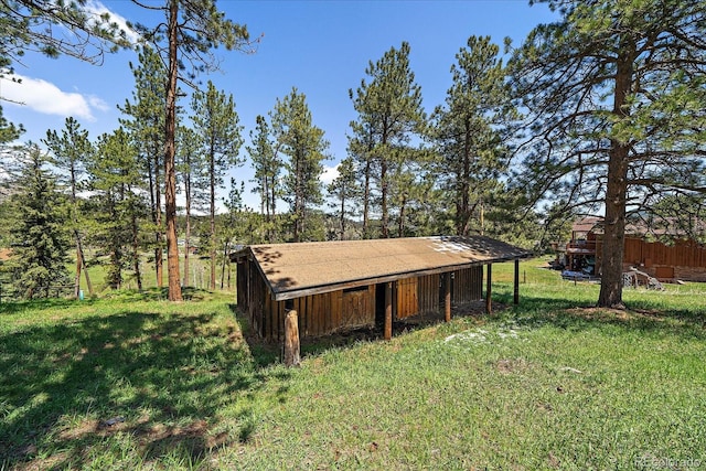 29827 Gigi Rd, Evergreen, CO 80439 - view of grassy yard featuring a pole building and an outbuilding