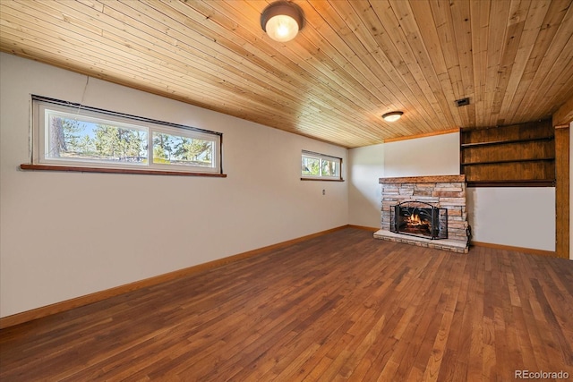 29827 Gigi Rd, Evergreen, CO 80439 - unfurnished living room with wood ceiling, a stone fireplace, and hardwood / wood-style floors
