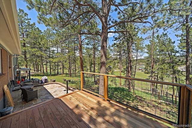 29827 Gigi Rd, Evergreen, CO 80439 - wooden deck featuring a patio