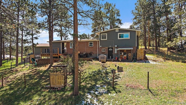 29827 Gigi Rd, Evergreen, CO 80439 - rear view of house with a deck and brick siding