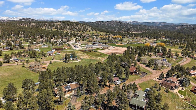 29827 Gigi Rd, Evergreen, CO 80439 - aerial overview of property's location with mountains and nearby suburban area