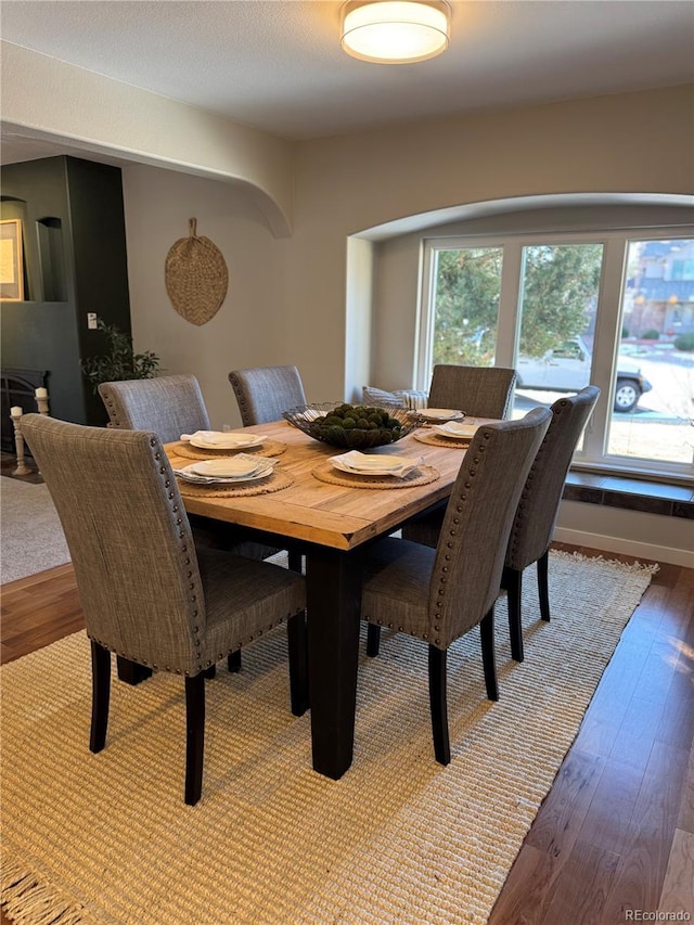 dining area with wood-type flooring