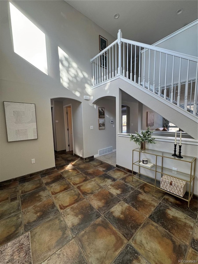 interior space featuring a towering ceiling