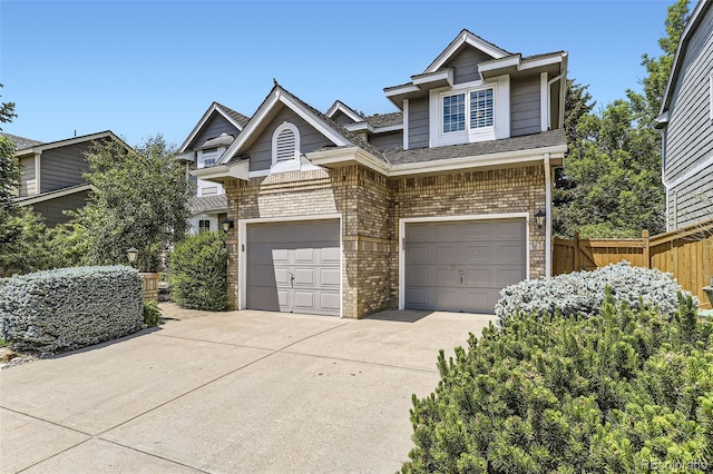 16257 E Belleview Pl, Centennial, CO 80015 - view of front of house featuring brick siding, driveway, and a garage