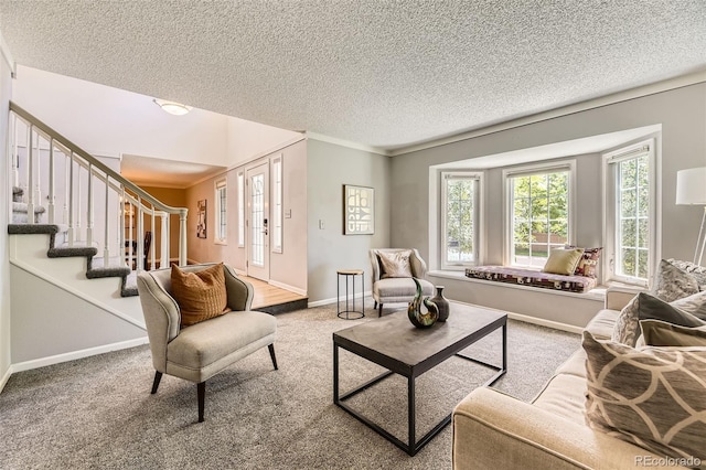 16257 E Belleview Pl, Centennial, CO 80015 - carpeted living area with a textured ceiling, stairs, baseboards, and ornamental molding