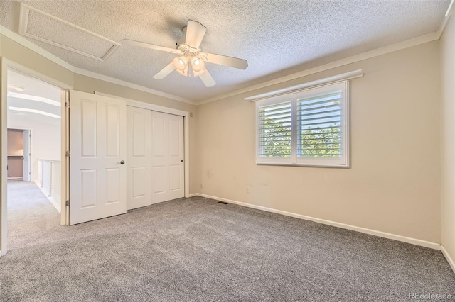 16257 E Belleview Pl, Centennial, CO 80015 - unfurnished bedroom with a textured ceiling, carpet floors, crown molding, a ceiling fan, and a closet