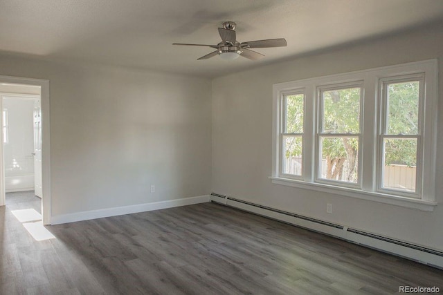 empty room with baseboards, a baseboard heating unit, a ceiling fan, and wood finished floors