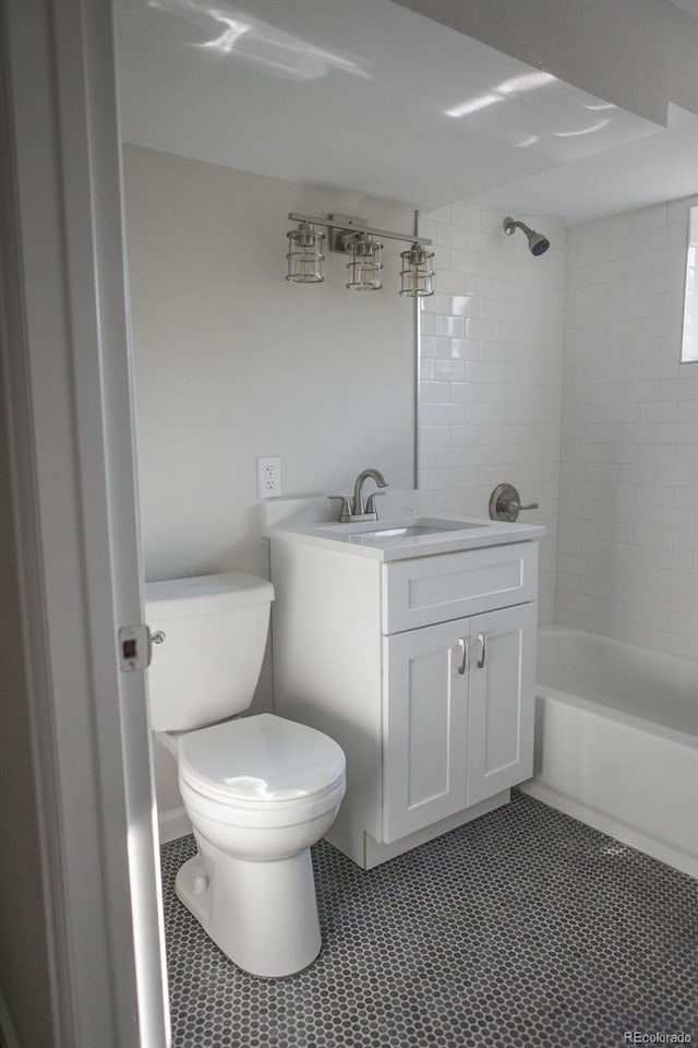 bathroom featuring vanity, toilet, tile patterned flooring, and shower / bath combination