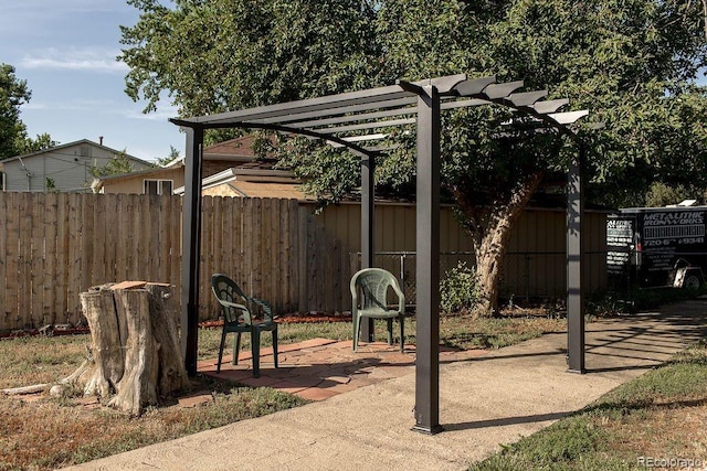 exterior space featuring a pergola and fence