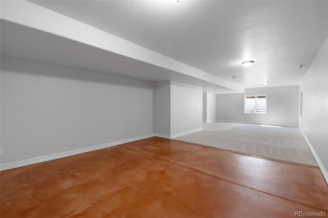 7436 Centennial Glen Dr, Colorado Springs, CO 80919 - bonus room with finished concrete floors, a textured ceiling, and baseboards