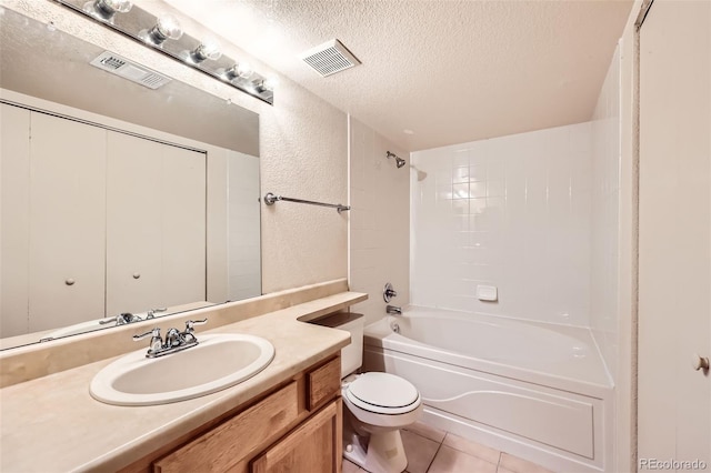 bathroom with a textured ceiling, toilet, vanity, tile patterned floors, and bathtub / shower combination