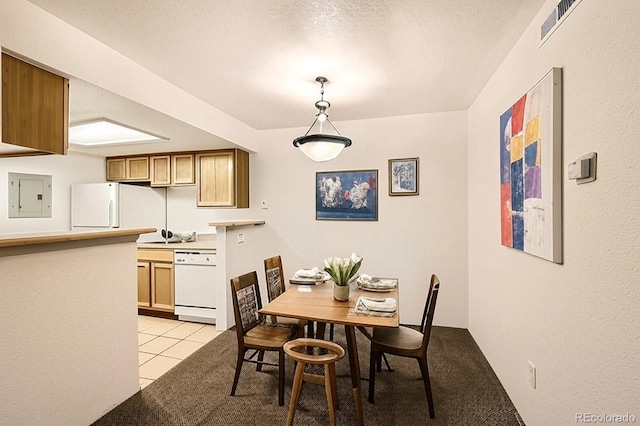 10293 E Peakview Ave Unit F104, Englewood, CO 80111 - dining room featuring electric panel, light tile patterned floors, and a textured ceiling