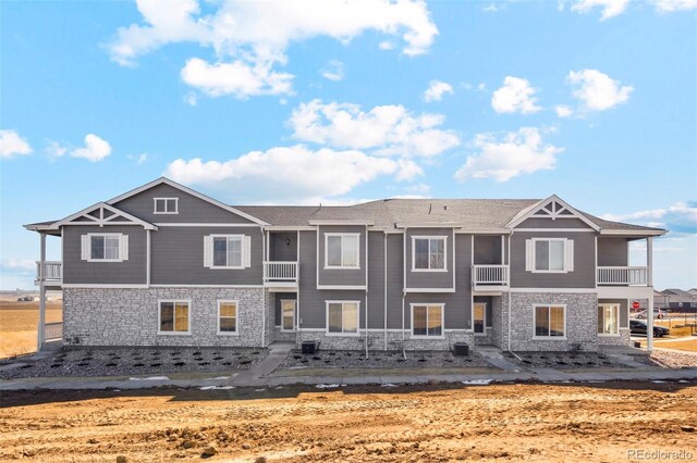 161 Robin Rd, Johnstown, CO 80534 - rear view of house featuring stone siding and cooling unit
